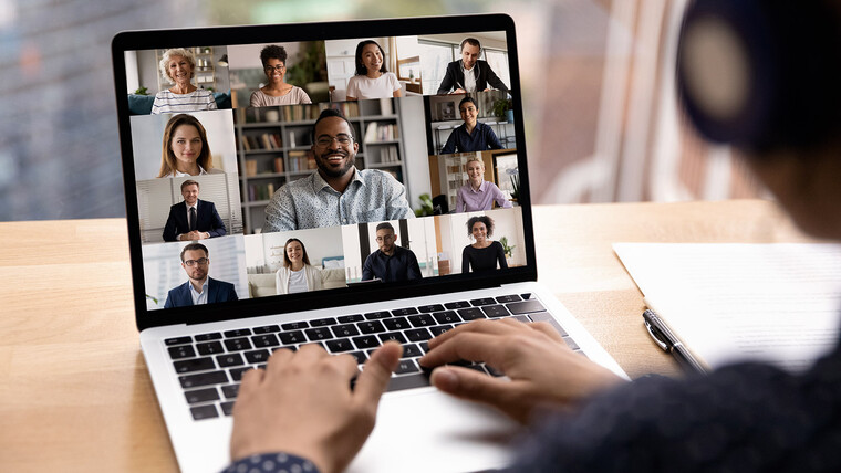 A laptop showing 13 users in a video call
